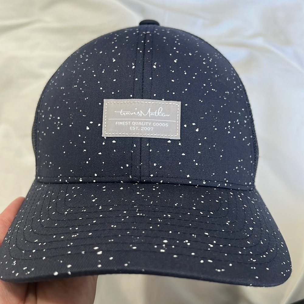 Navy blue Travis Matthew’s golf hat..